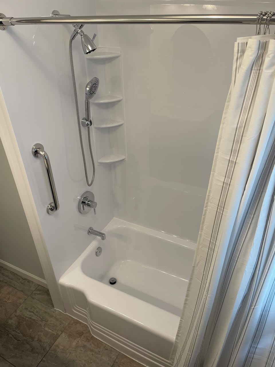 Shower tub combo located in full bath on main floor