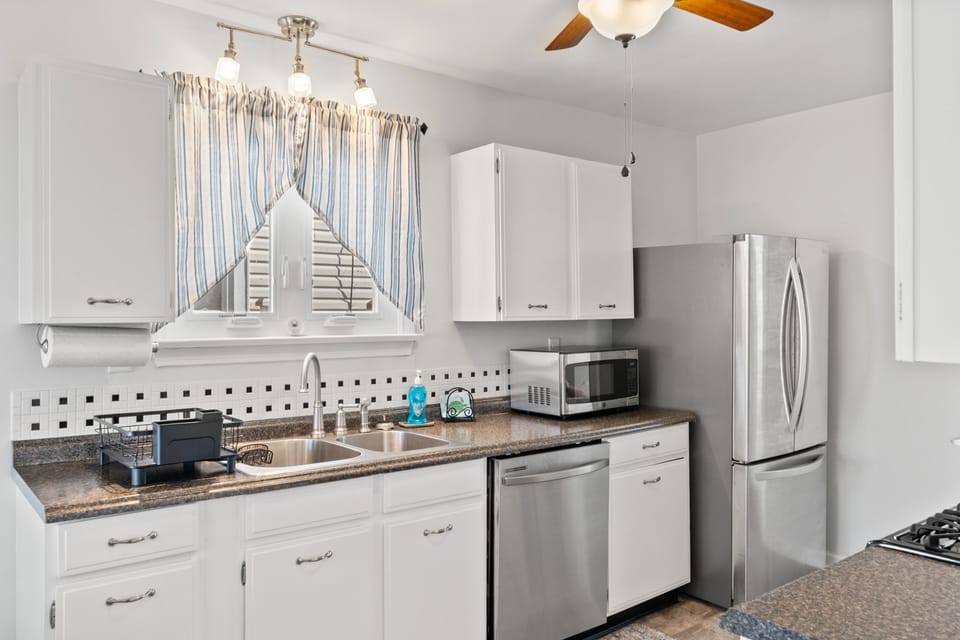 Stainless steel refrigerator and dishwasher, microwave, & ceiling fan