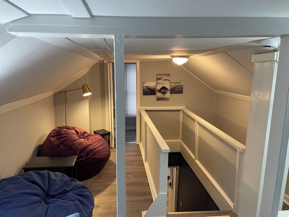 Upstairs loft, sitting area and stairwell to main floor
