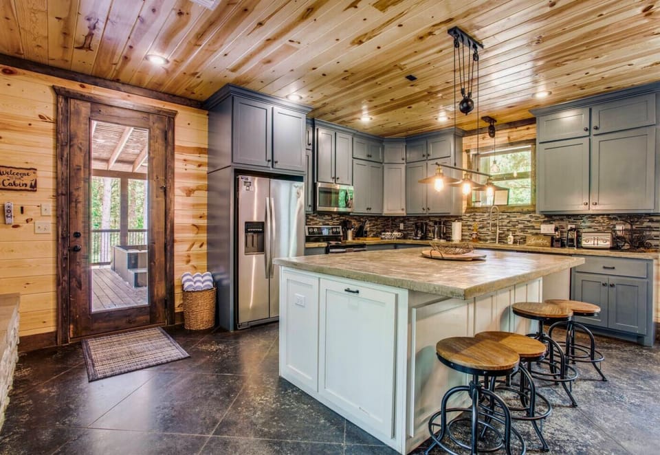 The heart of the cabin, this kitchen blends style and function with its open layout, modern appliances, and ample counter space.