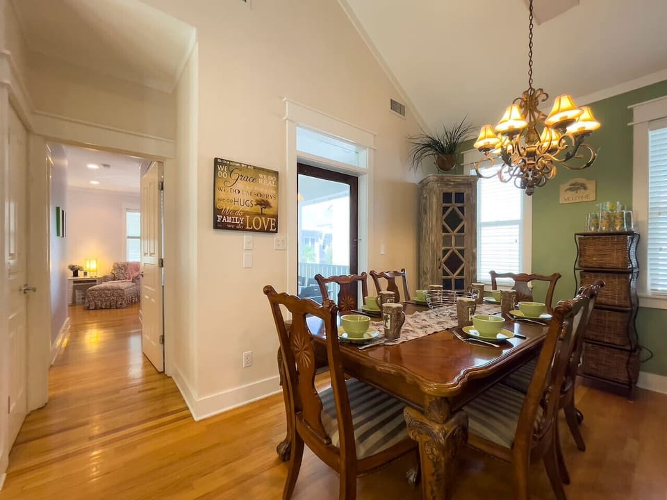 Second floor master bedroom with chaise lounge and access to the covered dining porch