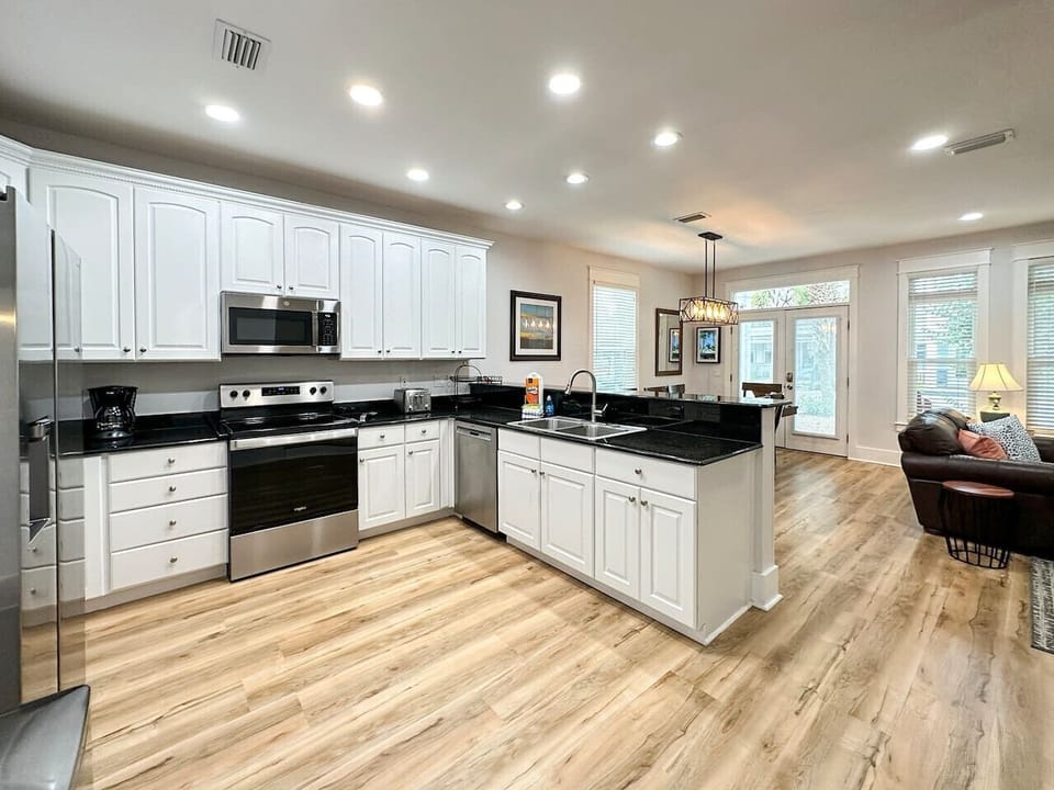 Kitchen affords plenty of counter space for meal prep