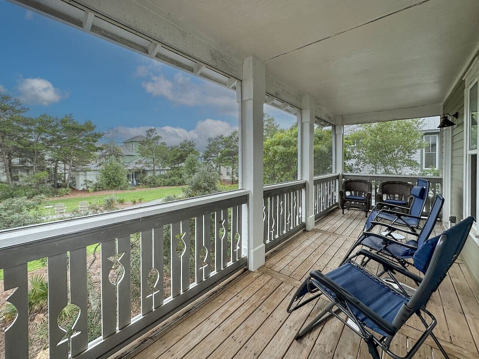Second floor screened porch overlooks one of the Seacrest Beach parks