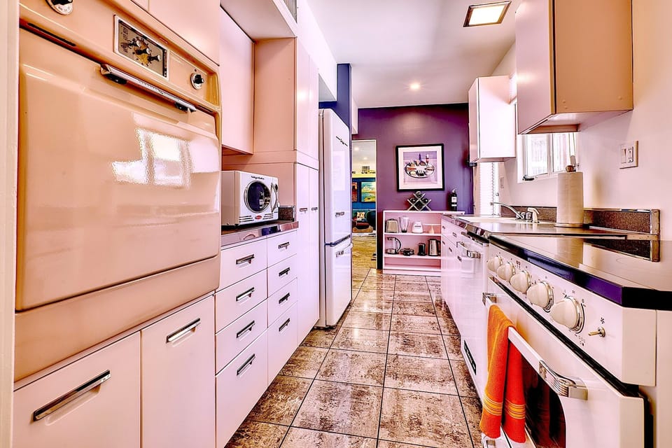 Vintage kitchen with modern appliances and original pink oven (just for show).
