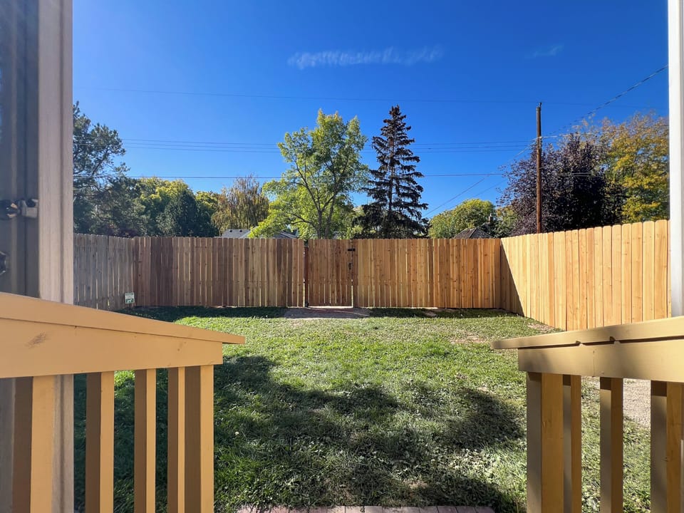 Private fenced yard with access to designated parking for 2 vehicles