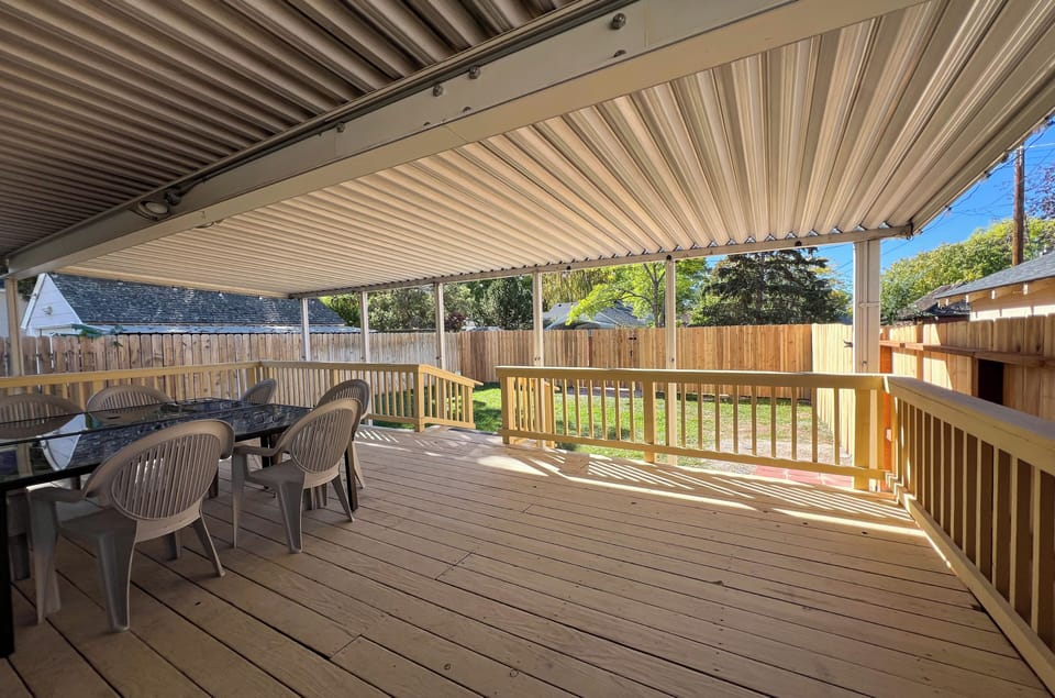 Extra large covered deck with outdoor dining and seating for 5