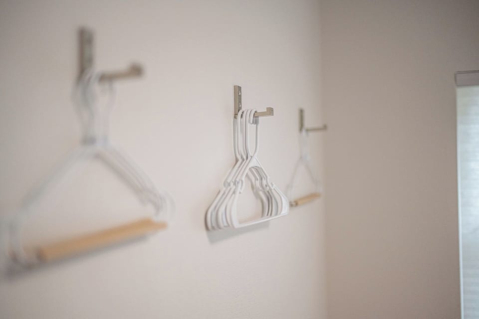 You'll have ample hangers + luggage stands to unpack and stay awhile.