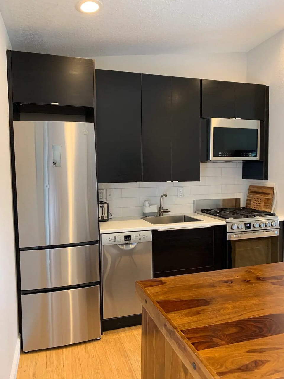 Home has TWO, fully equipped kitchens with dishwasher, GAS stove + slim-line refrigerator with two freezers.