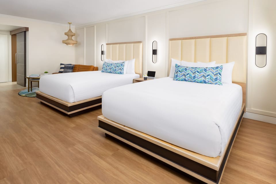Stretch out on plush doubles in a bright, airy retreat.
