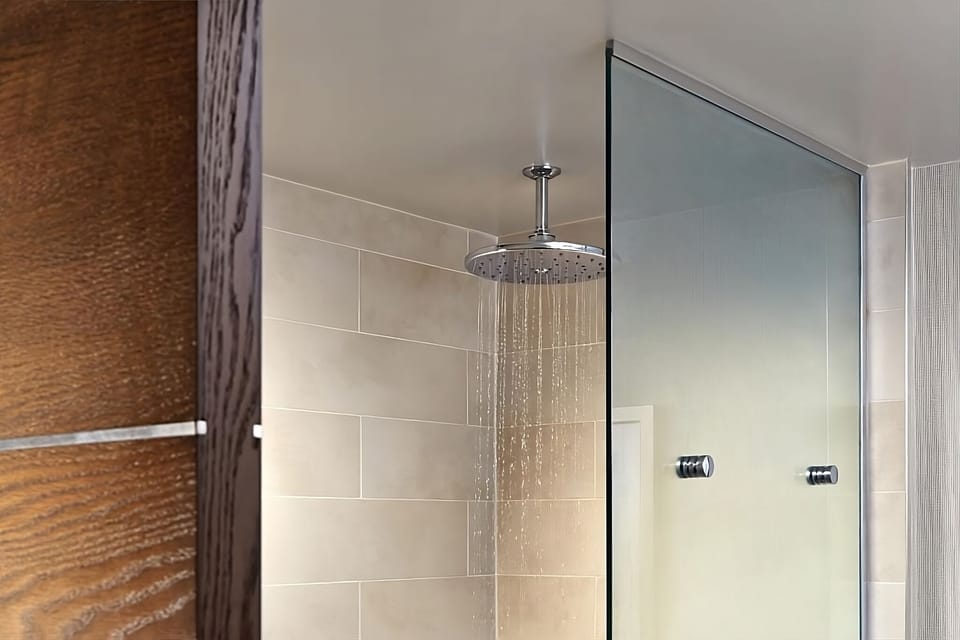 Refresh under a soothing rainfall shower after adventure-filled days.