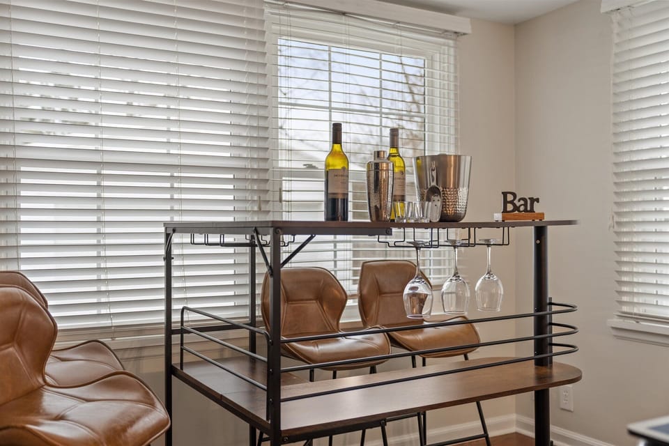 Beverage cart in the game room with wine glasses