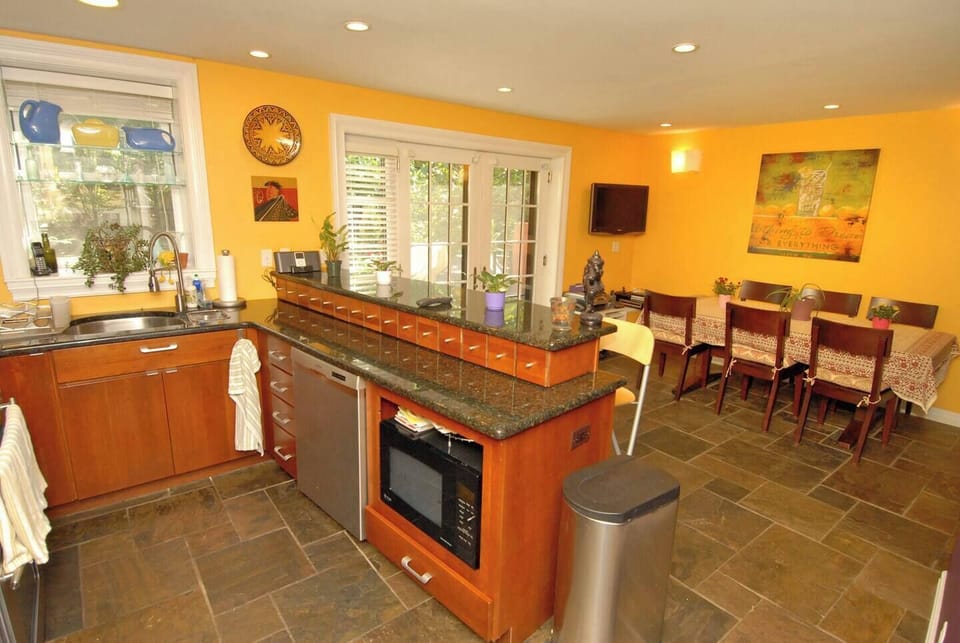 Kitchen & dining area. Solid cherry cabinets, dual-height counter/breakfast bar.