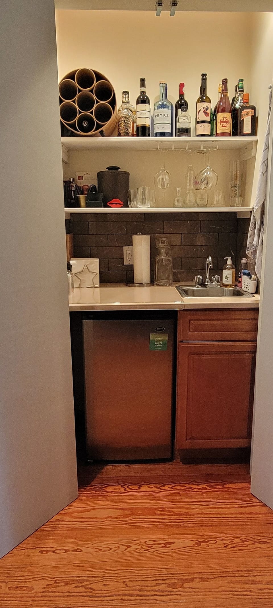 The minibar hidden by the feature wall off the living room. Ice without stairs!