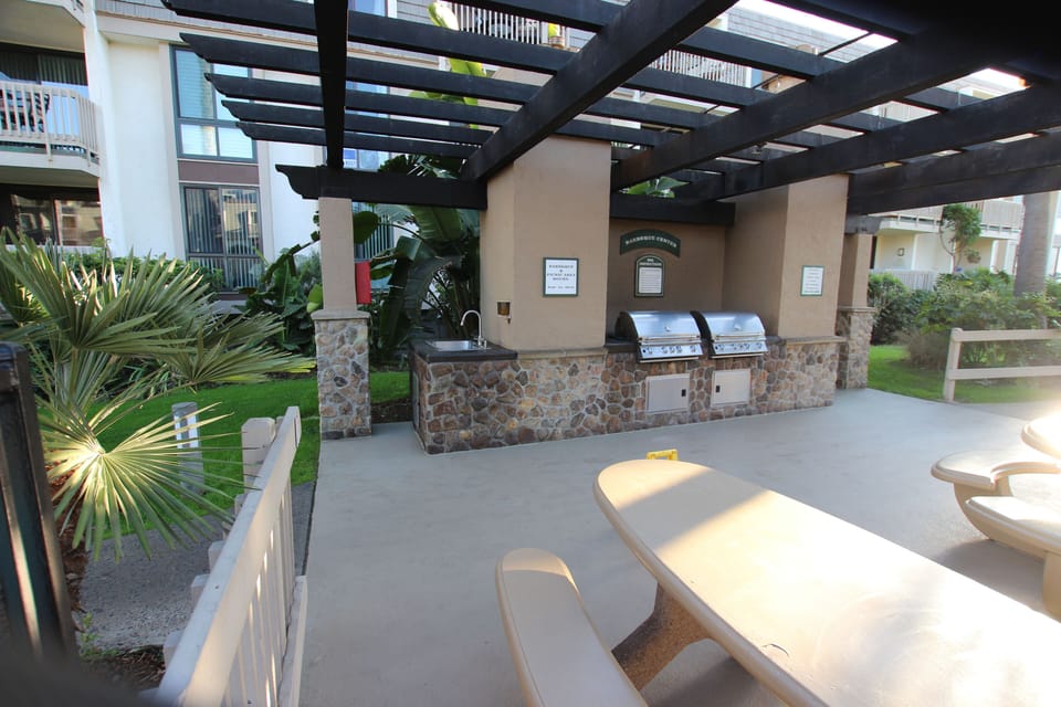 BBQ's and Picnic tables overlooking the pool.