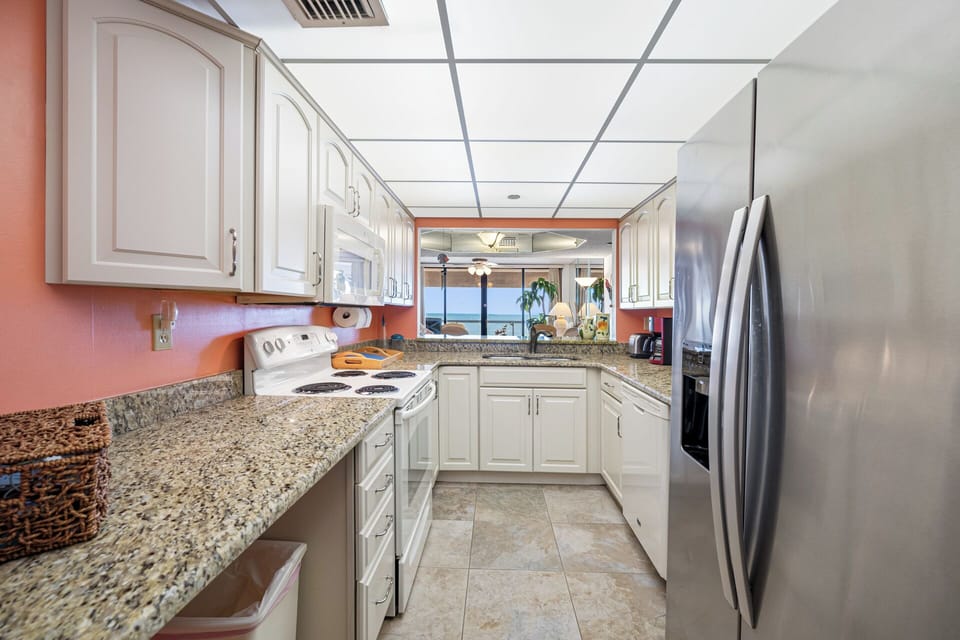 Fully equipped kitchen with modern appliances and ample counter space.