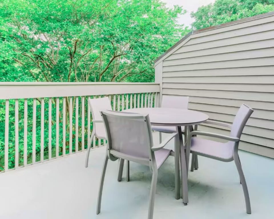 Sip morning coffee on the private balcony among the trees.