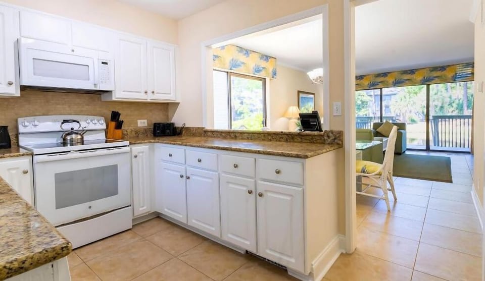 Cook easy meals in a bright kitchen with ample counters.