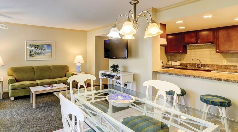 Share cocktails at the dining table beside the open kitchen.