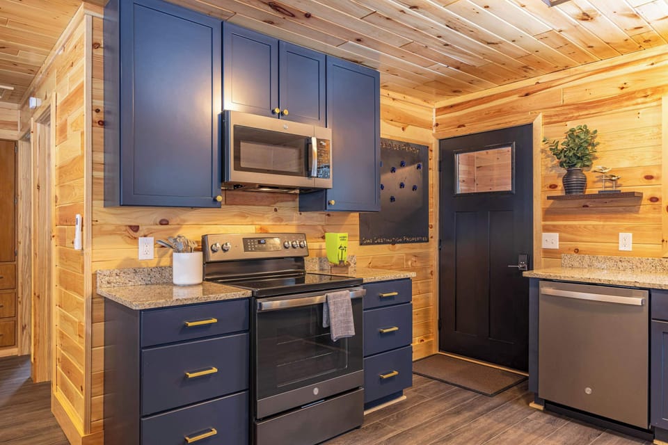 Kitchen Detail — Full-Size Fridge, Stove, and Counter Space