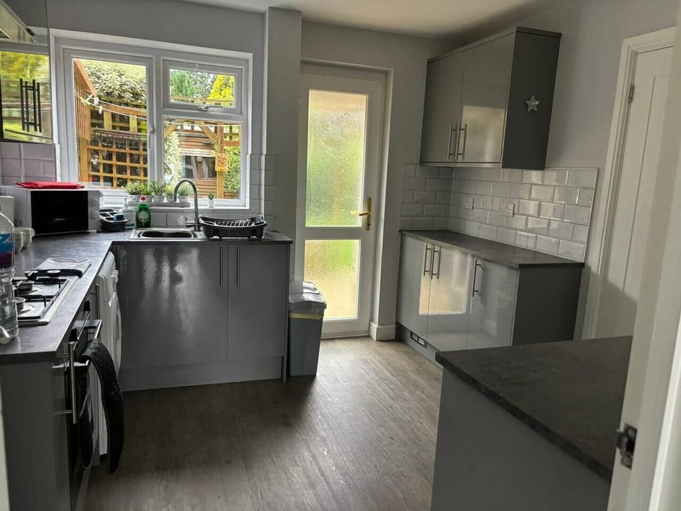 Cozy kitchen, happy vibes. Book your stay today!