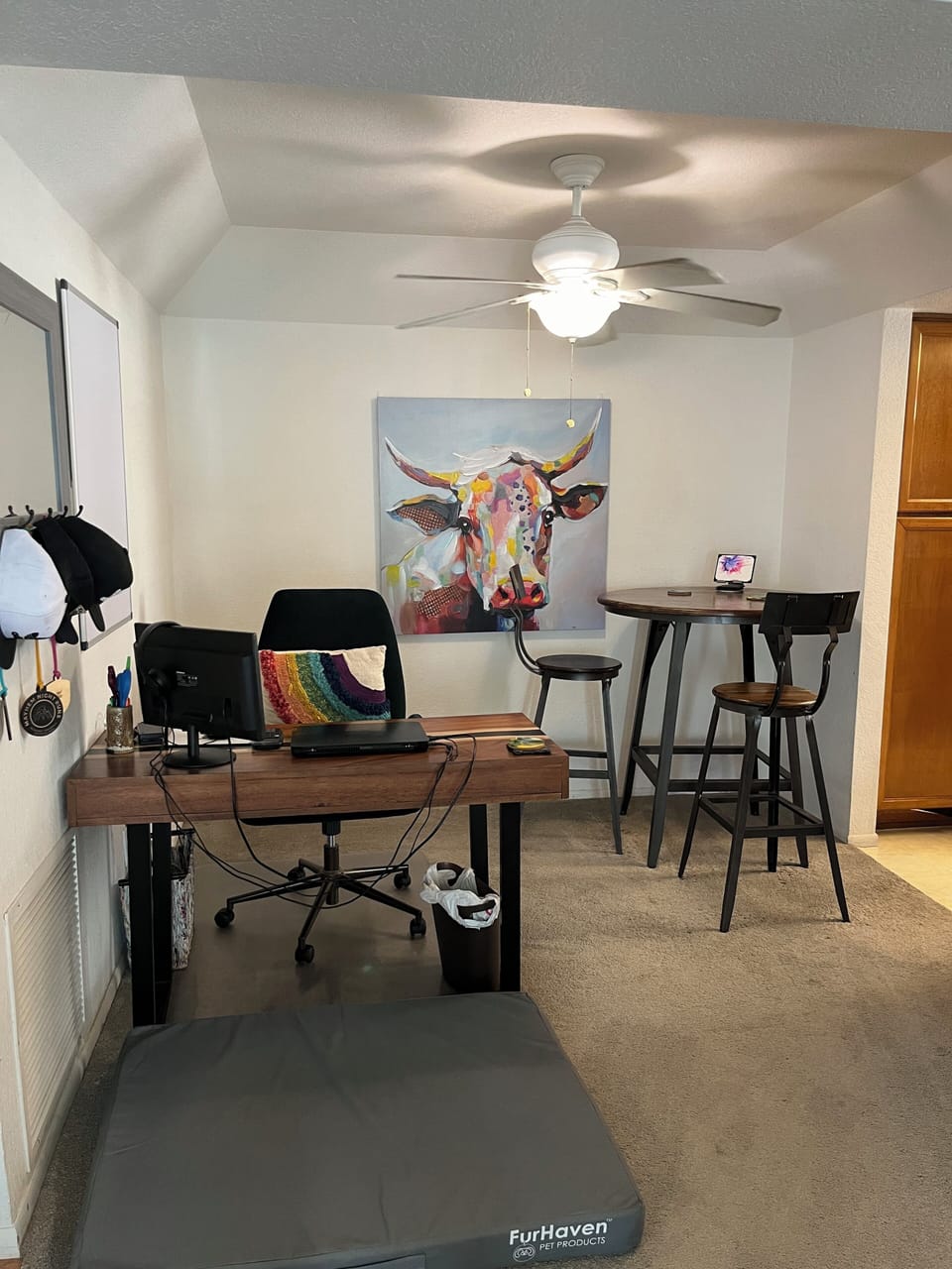 Work from home with a comfortable desk and dining area