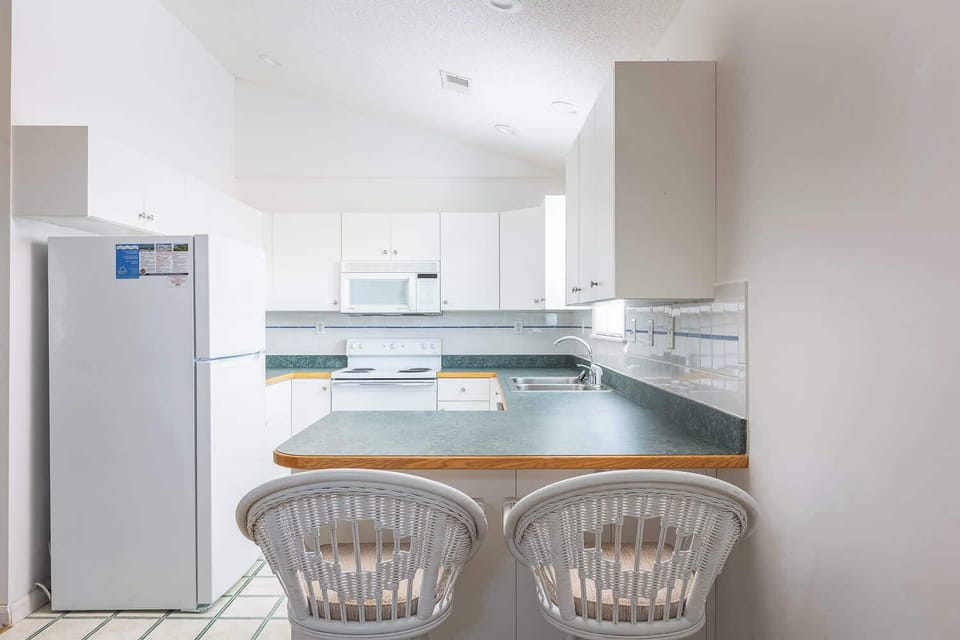 Fully-Equipped Kitchen w/ Breakfast Bar (seats two)