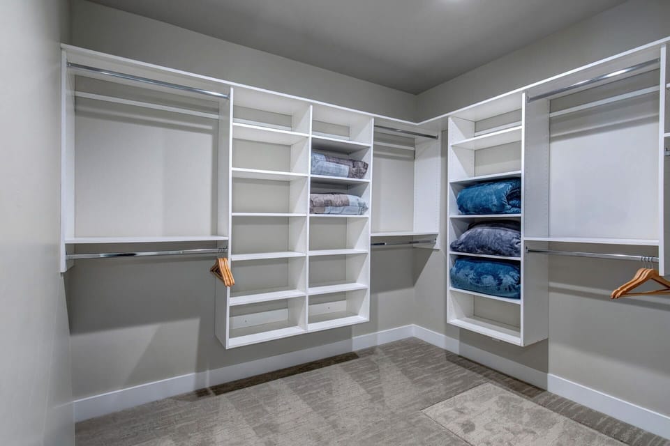 Mayflower Village 991: Main level primary walk-in closet.