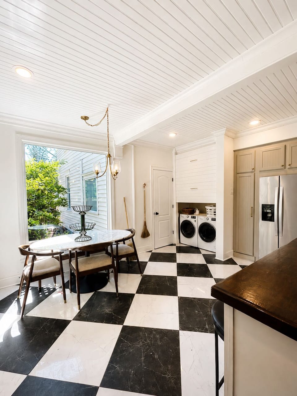 Open kitchen with sunny breakfast seating area.