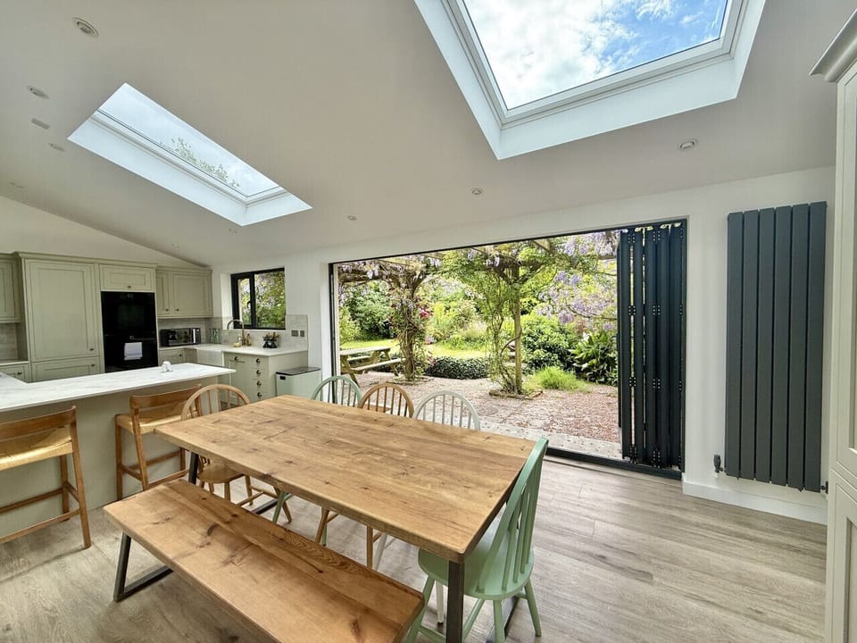Open plan kitchen/diner with garden access, utility and wc