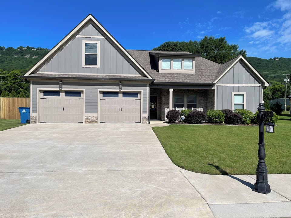Front view of the house with parking for 4 vehicles & is wheelchair accessible.
