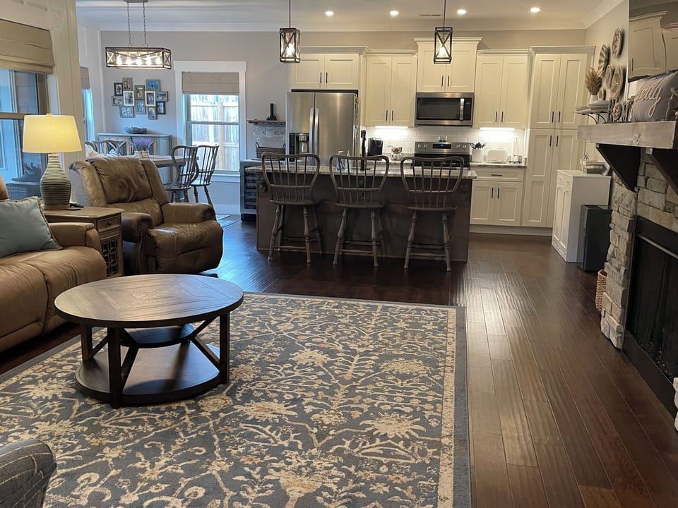 Open-concept living room, kitchen, dining area for all inclusive gatherings.