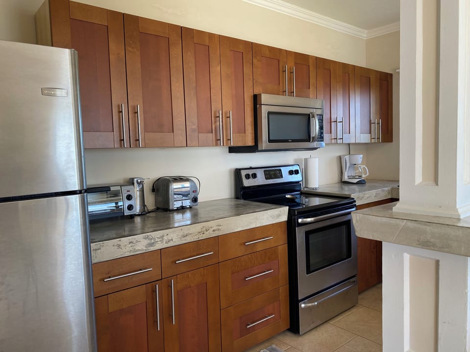 Stainless kitchen outfitted for in home dining
