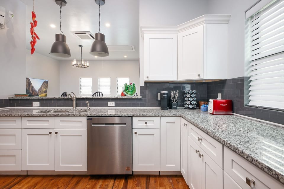 Charming kitchen nook with a cozy ambiance, offering a well-stocked space.