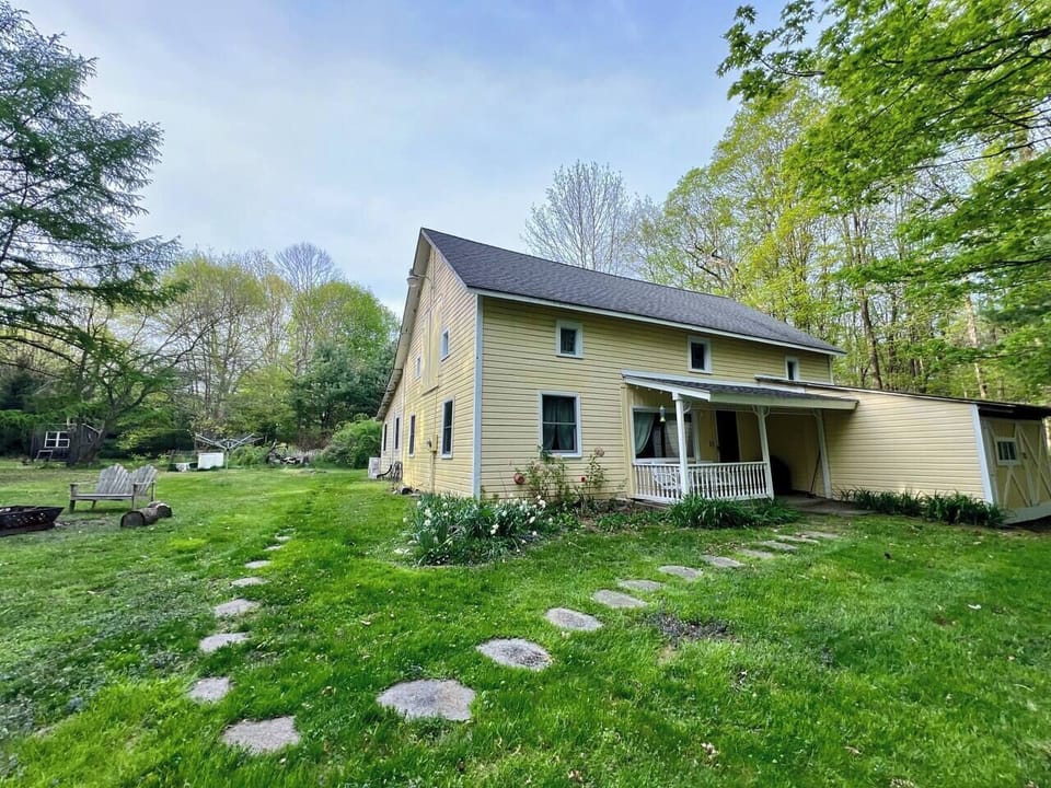 Cottage front with path and fire pit