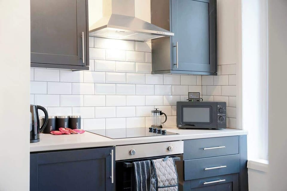 Family-friendly kitchen oasis equipped with all essentials, including a washer & dryer, oven, fridge and full cookware set.