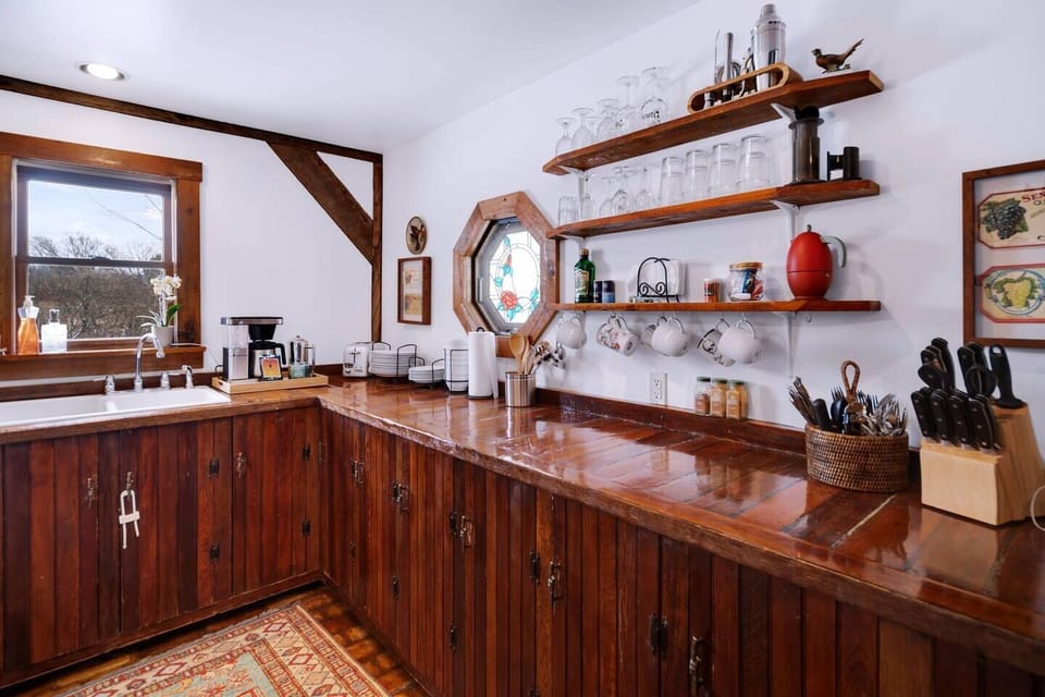 Our well- stock kitchen includes settings for 8 and room for meal prep. 