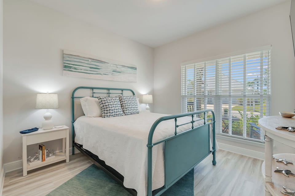Drift off in your coastal-inspired bedroom, where soft ocean hues and natural light create the perfect sanctuary for restful nights.