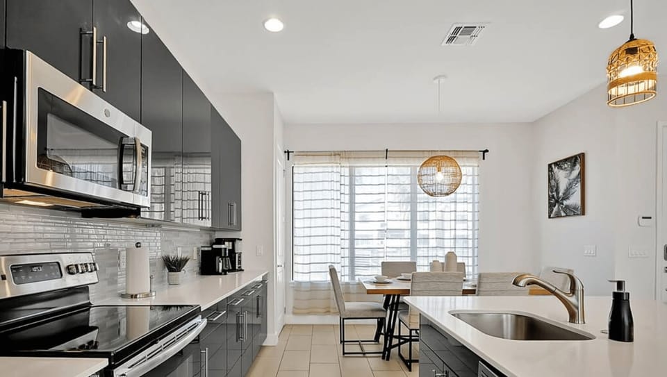 A beautifully designed kitchen with sleek finishes and all the essentials, perfect for preparing delicious meals.