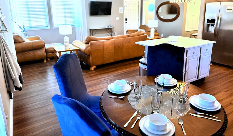 Comfy, open concept living area with tons of natural light & a 50" Roku TV. 