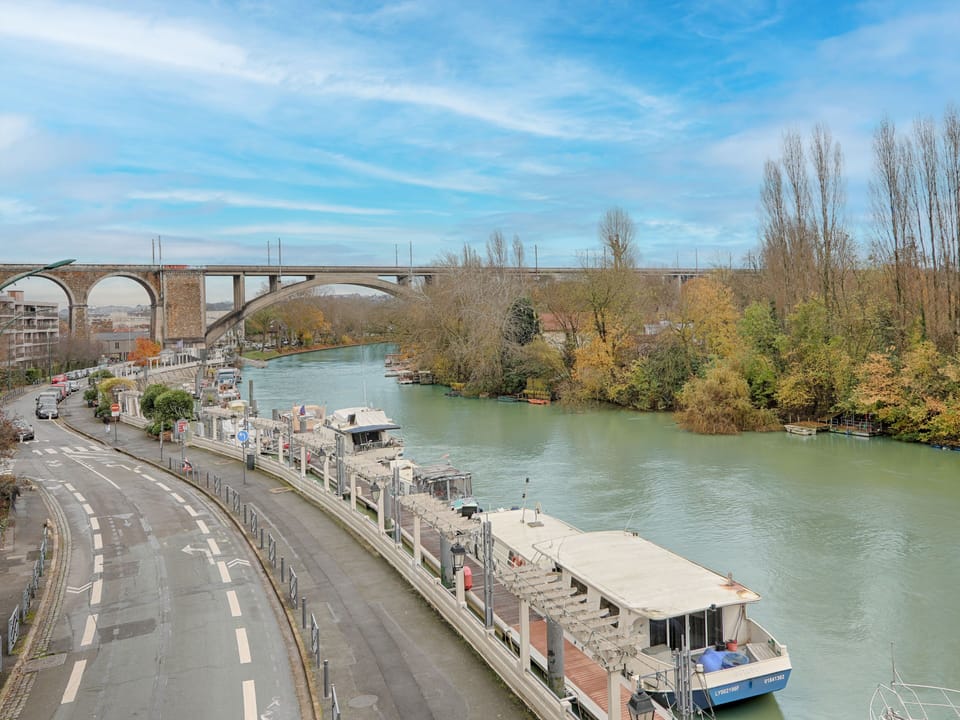 Scenic view of the Marne River with charming surroundings, offering a tranquil setting perfect for walks and river cruises.