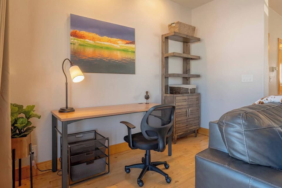 The dedicated workspace is conveniently located next to the living room.