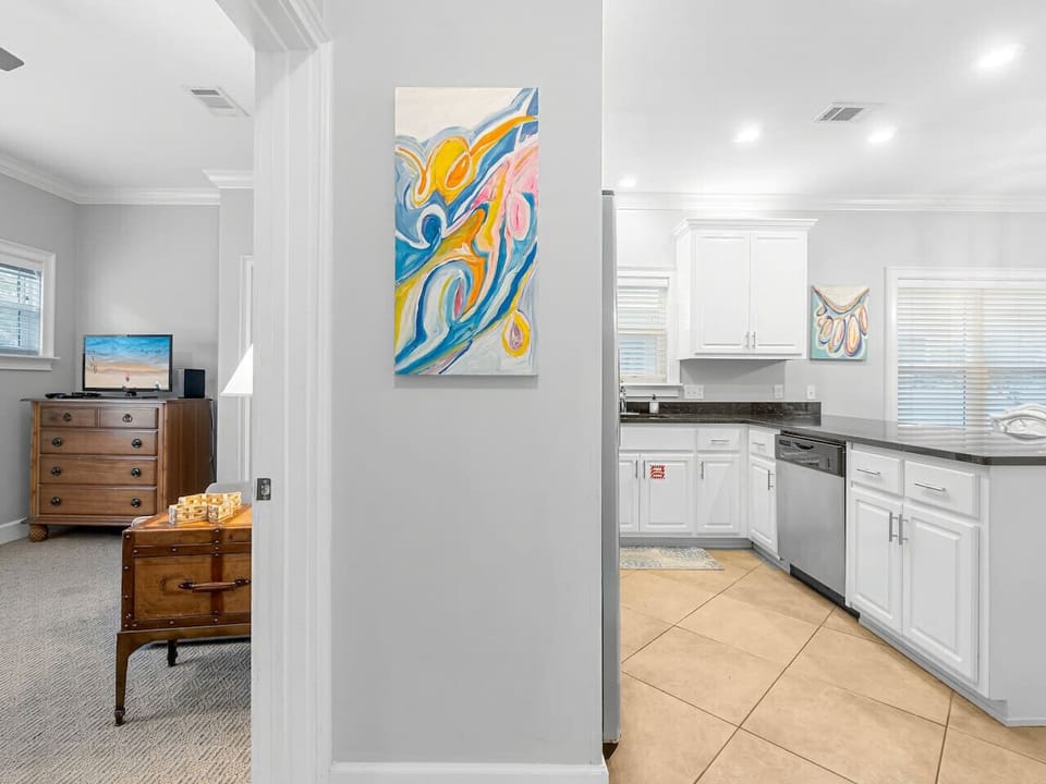Main living area entry way with bedroom on the 1st floor, Spacious Kitchen & Dining/Living Area.  Full bath on the first floor