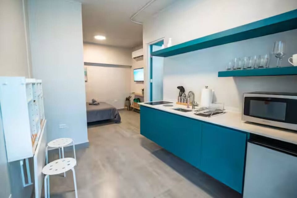 Cook with ease in a stylish kitchen where practical layout and soft lighting create a peaceful atmosphere