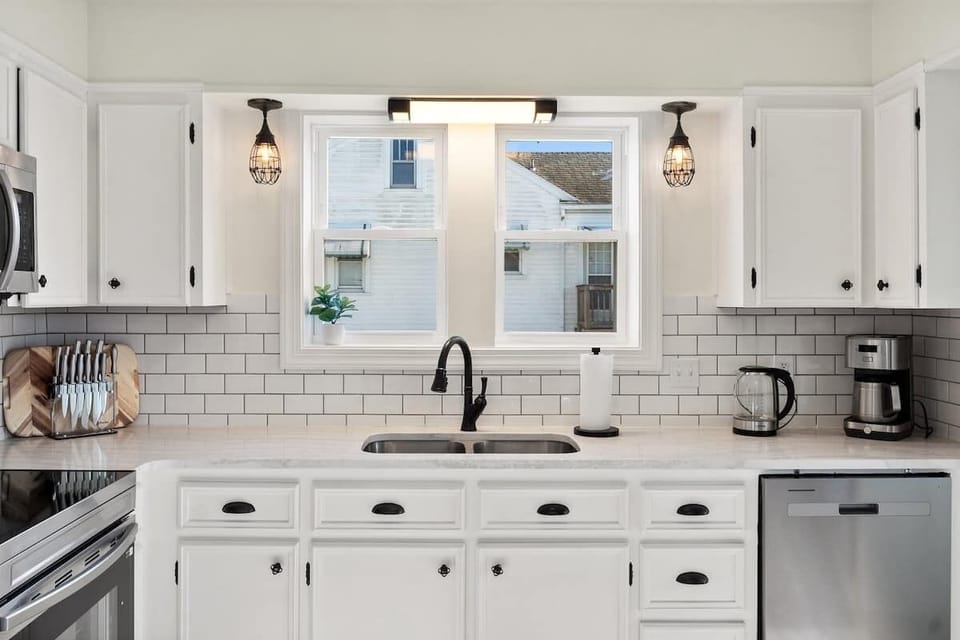 Fully furnished Kitchen. Sink, Range, Microwave, Tea Kettle, and coffee maker. Knives, Pots, pans, baking sheet and paper towels.