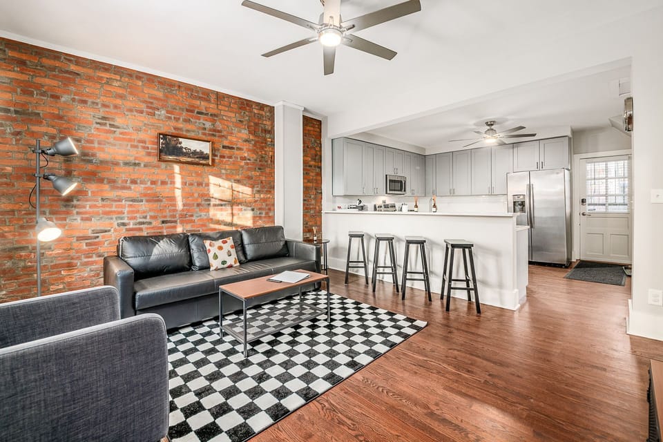 View from the living area to the well-appointed full kitchen.