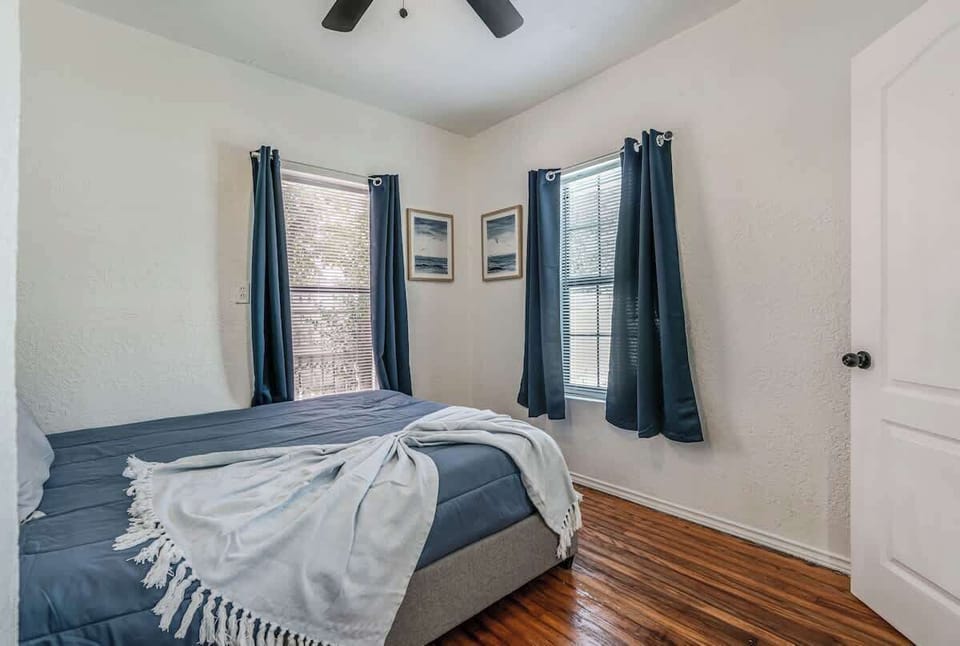 Bedroom at front of house.  Windows to front of house and side of house.