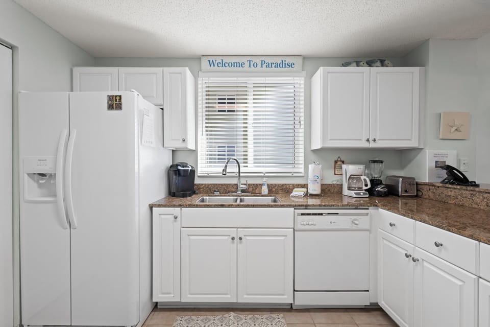 Kitchen - The spacious kitchen features all electric appliances which include a dishwasher, refrigerator with ice and water in the door, and both a regular coffee pot, and k-cup style maker.
