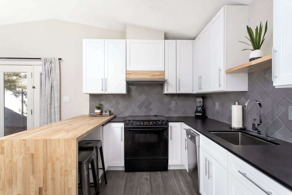 "Whip up your favorite meals in our spacious and stylish full kitchen."