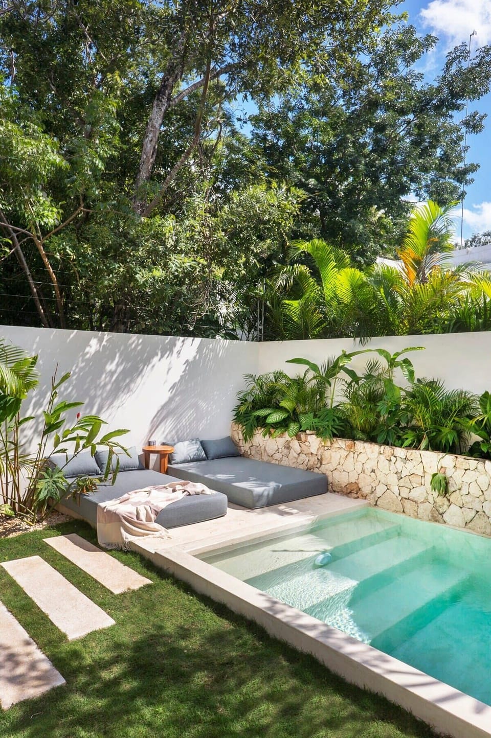 Modern and comfortable sun loungers by the pool.