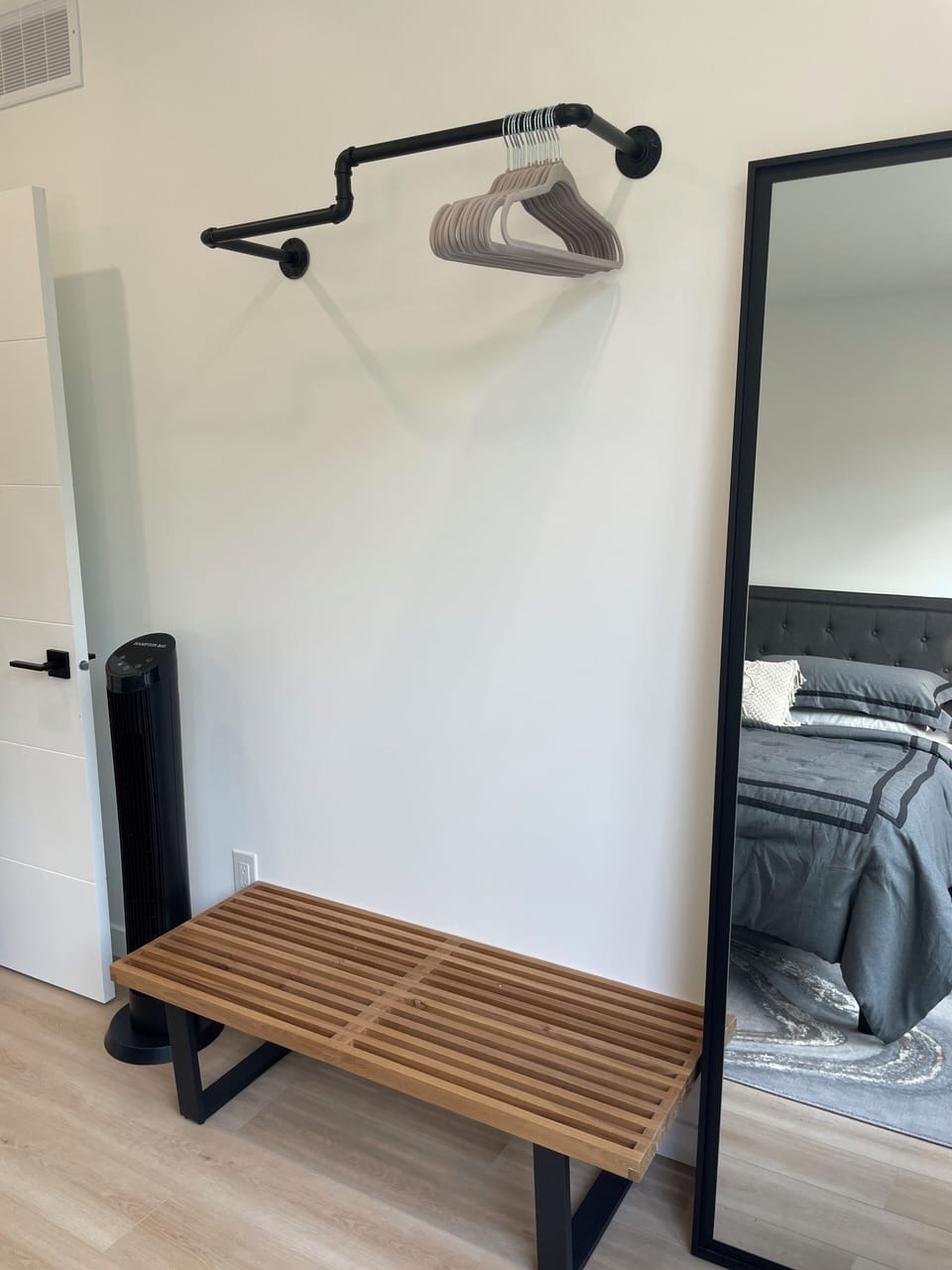 bench doubles as luggage rack. Hanging clothes storage